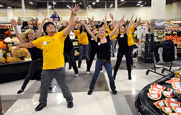 Volunteers in a grocery store flash mob