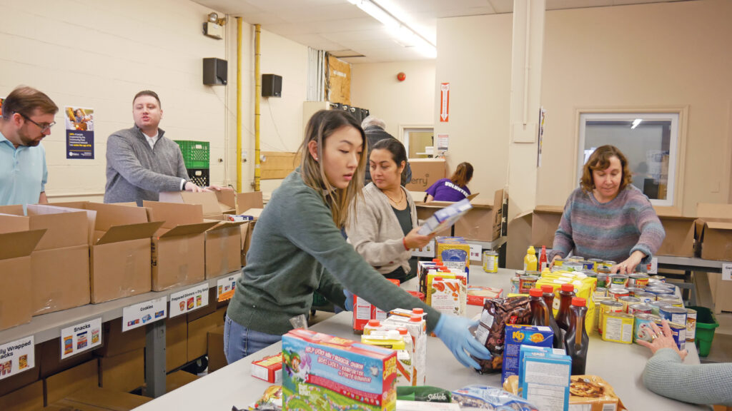 Paquette Travers team sorting non-perishable food.