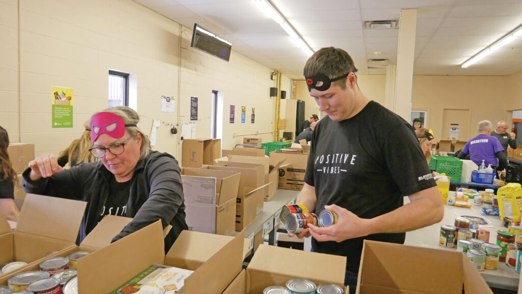 Blendtek team 2 sorting non-perishable food.