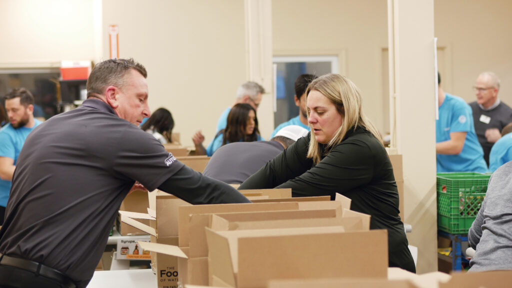 Parkway Ford team sorting and inspecting non-perishable food.