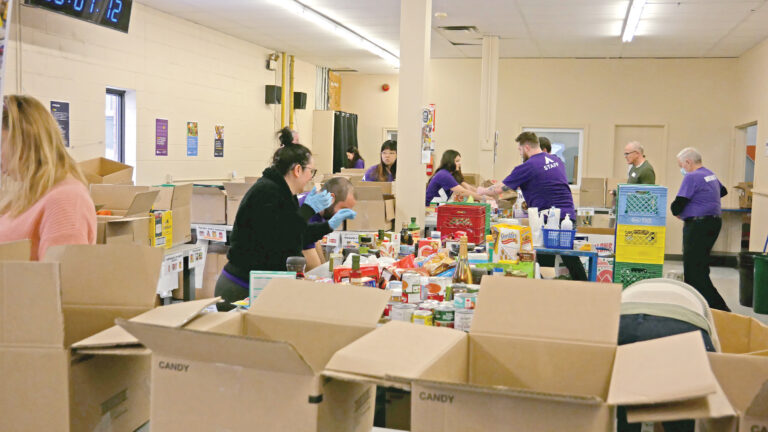 Accommod8u team 1 sorting non-perishable food.