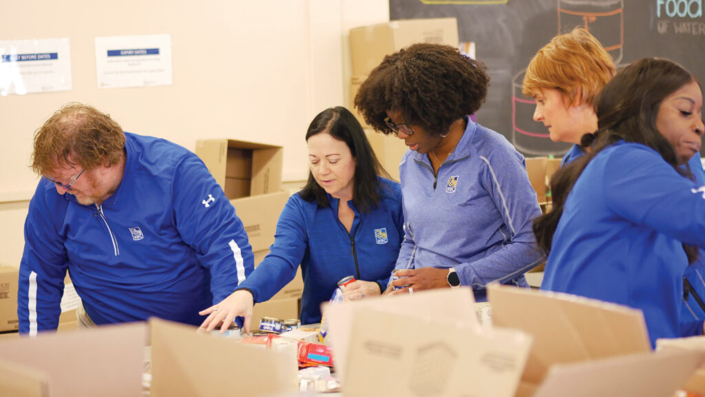 RBC KWC Commercial team unloading and sorting non-perishable food.