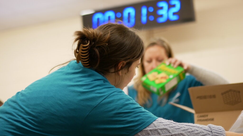 Dillon Consulting team 2 unloading and sorting non-perishable food.