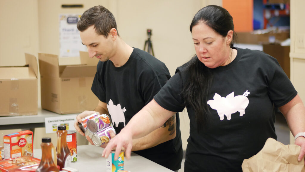 Conestoga Meats team sorting non-perishable food.