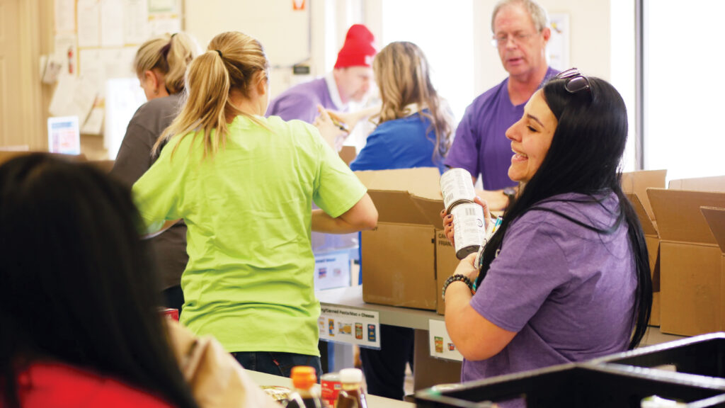 Waterloo Region Association of Realtors (WRAR) team sorting non-perishable food.
