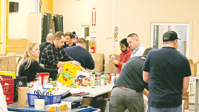 Steed and Evans team sorting non-perishable food.