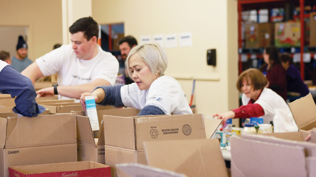 Policaro Group team sorting non-perishable food.