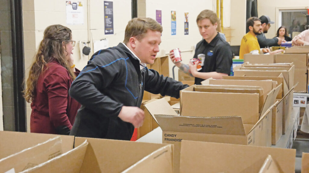 Libro team sorting and inspecting non-perishable food.