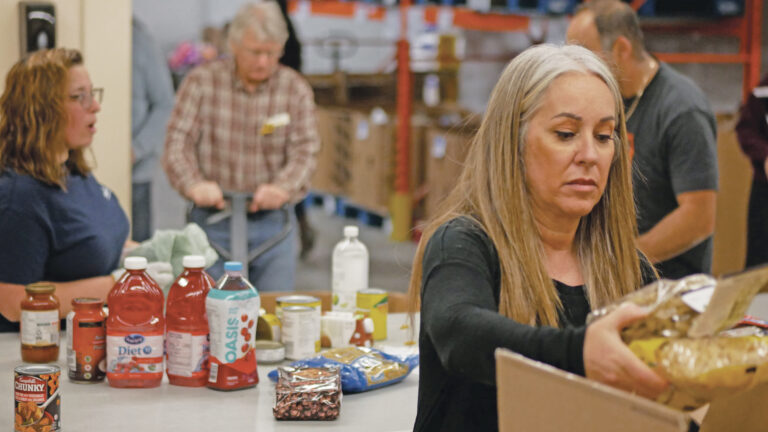 Friends of The Food Bank team sorting non-perishable food.