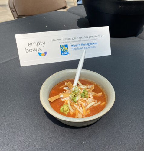 Empty Bowls 2023 - A bowl of tortilla soup on a table.