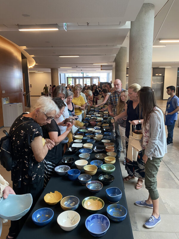 Empty Bowls 2023 - People selecting their bowls.