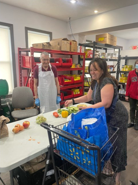 A volunteer serving a participant.