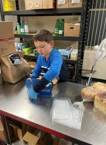 A young volunteer at The Salvation Army Cambridge Community Services.