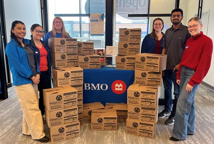 The BMO team from the Fischer-Hallman and Bleams branch with donations for The Food Bank.