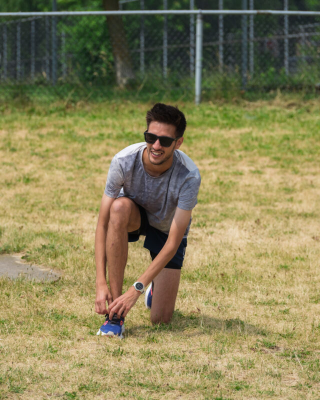 Alex lacing up his shoes.