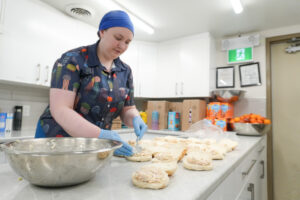 Chef Madeline Watkins preparing a meal.