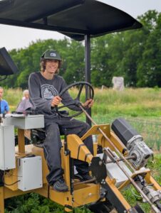 Werkr Tractors’ small electric tractor in the field.