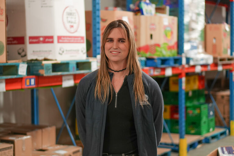 Phoenix Scheerer in The Food Bank's warehouse.