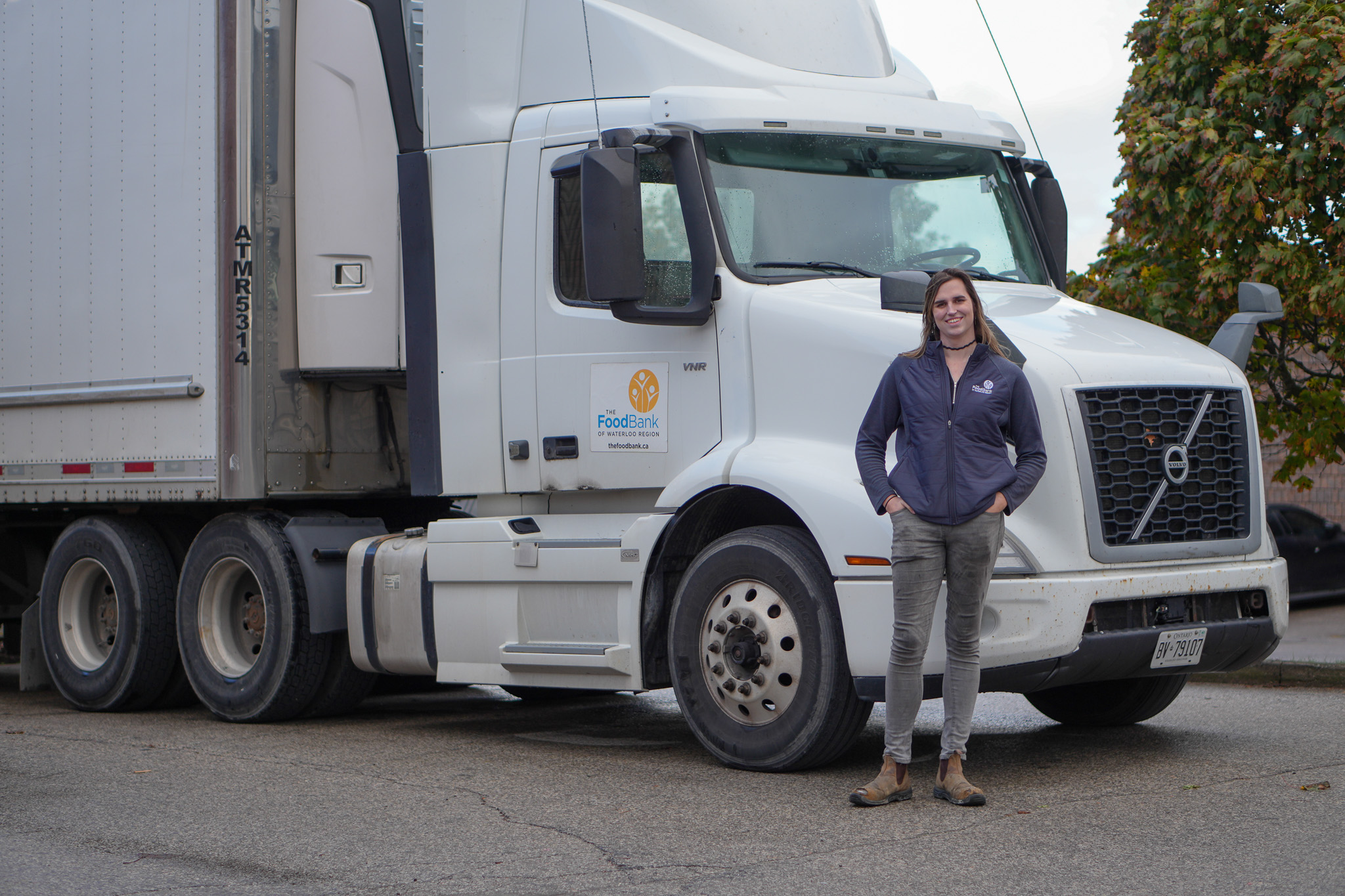 Phoenix Scheerer with one of the The Food Bank's trucks.