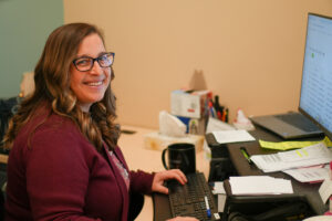 Lydia Tavares at her desk.
