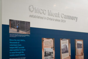 Inside MCC Ontario’s meat cannery in New Hamburg. Featuring a wall wiht the companies emblem and graphics.