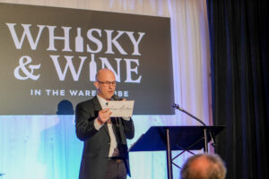 Dub Stenning of Fripp Auctions on stage.