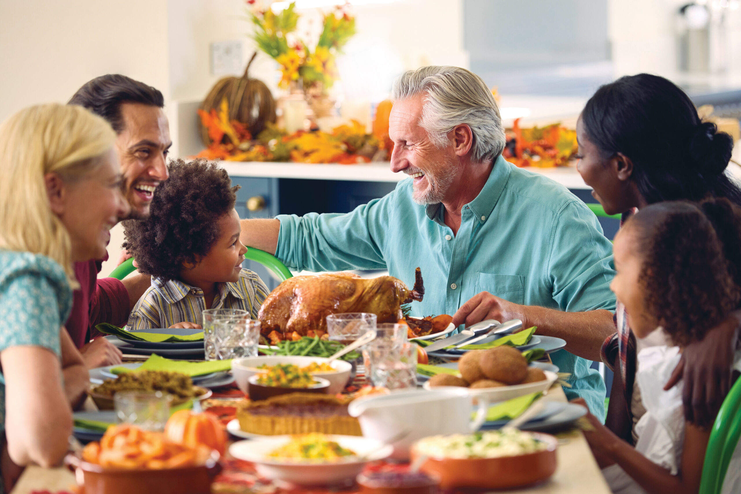 Family enjoying food at Thanksgiving