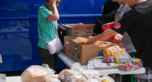 Tenants choosing food items.